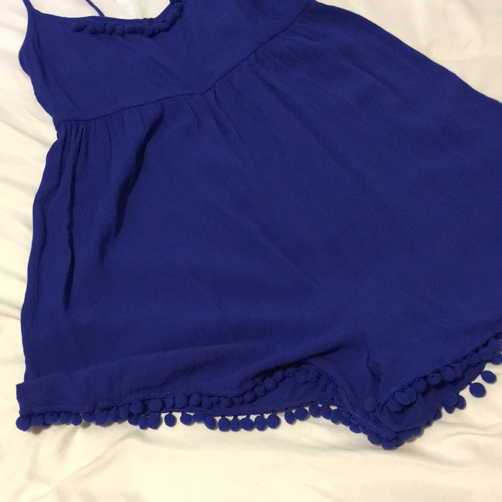 Royal blue romper with pom poms